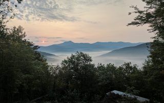 Misty sunrise view of Camel's Hump from the Butternut Cabin at Sleepy Hollow.