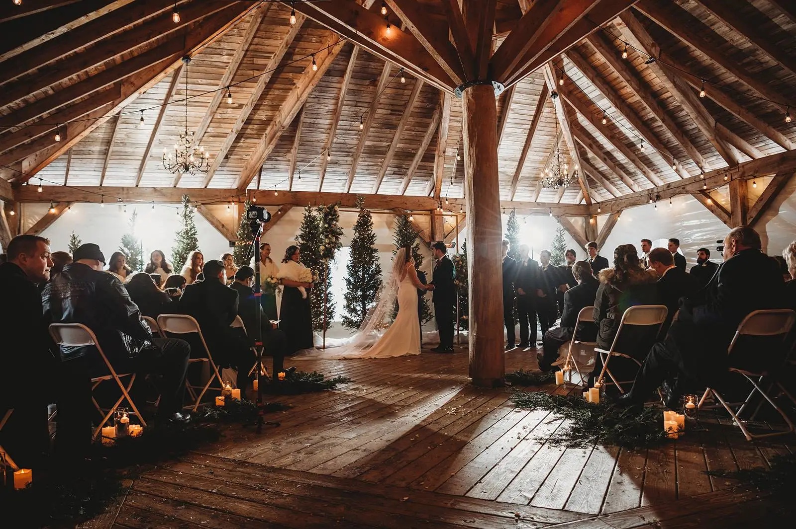 Couple at their winter Vermont wedding ceremony in the pavilion.