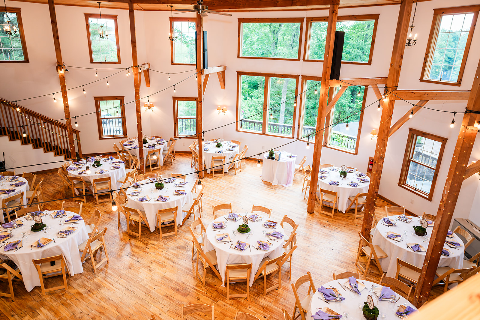 Whimsical Woodland Wedding at Sleepy Hollow Inn 6 round barn wedding reception set up