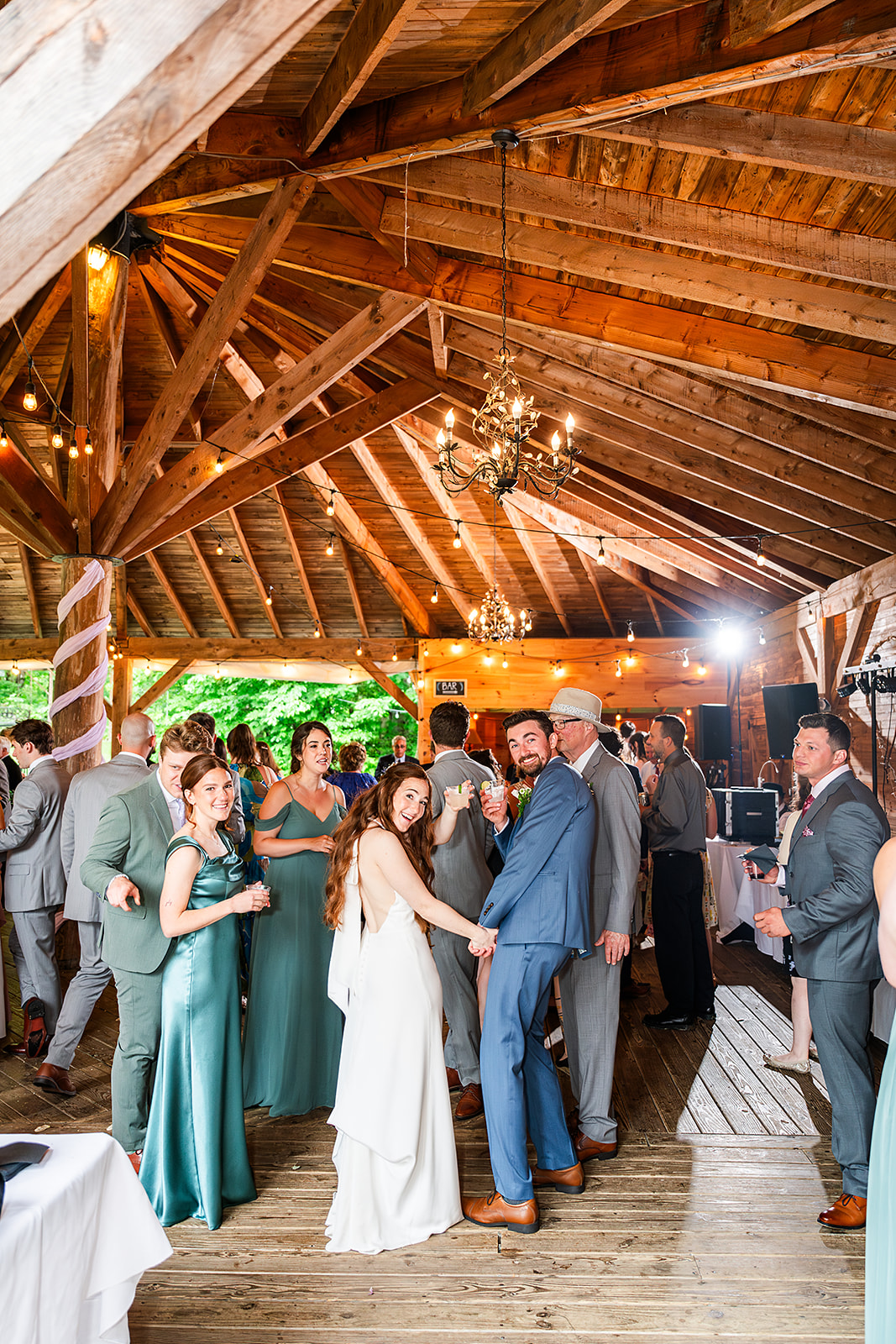 Whimsical Woodland Wedding at Sleepy Hollow Inn 13 wedding couple enjoying the cocktail hour with guests